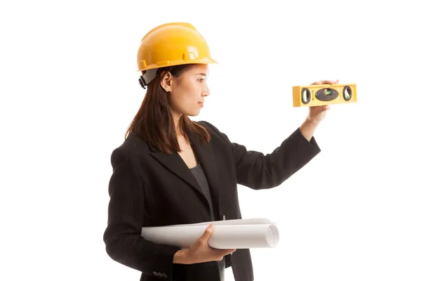 Asian engineer woman with blueprints and level. — Stock Photo, Image