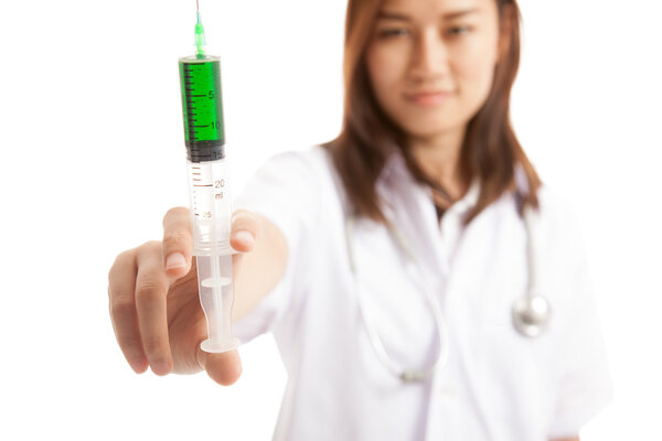 Young Asian female doctor  smile hold syringe  focus at syringe.