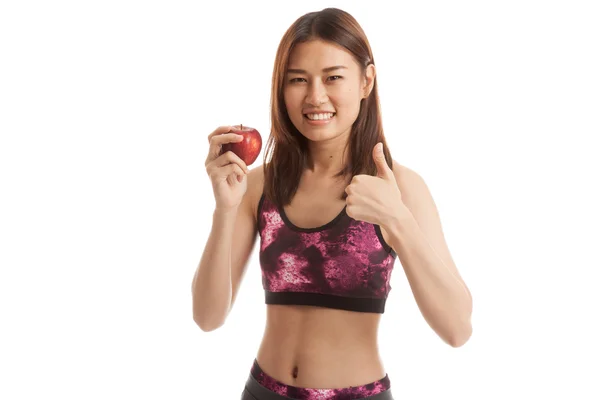 Mooie Aziatische gezond meisje duimen omhoog met rode appel. — Stockfoto
