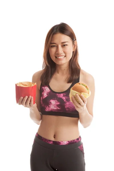 Krásná Asiatka zdravé s hranolky a hamburger. — Stock fotografie