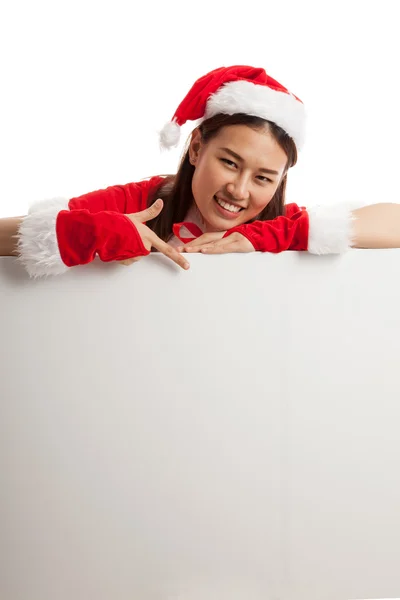 Asiático Natal Papai Noel menina apontar para baixo para sinal em branco . — Fotografia de Stock