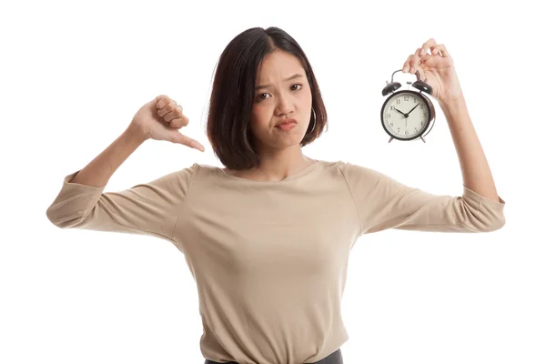 Young Asian business woman thumbs down with a clock — Stock Photo, Image