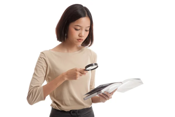 Asian business woman with a book and magnifying glass — Stock Photo, Image