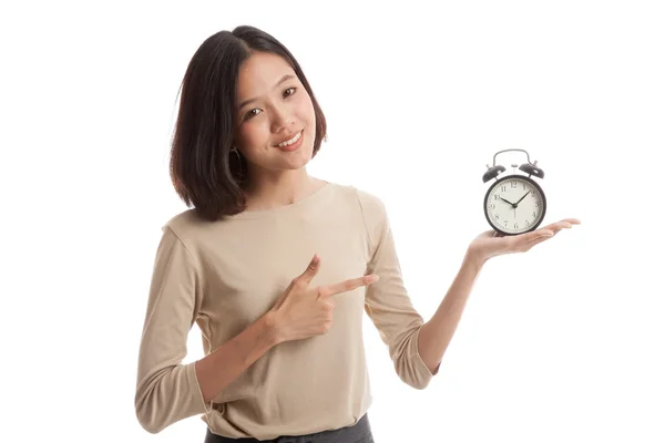 Young Asian business woman point to a clock — Stock Photo, Image
