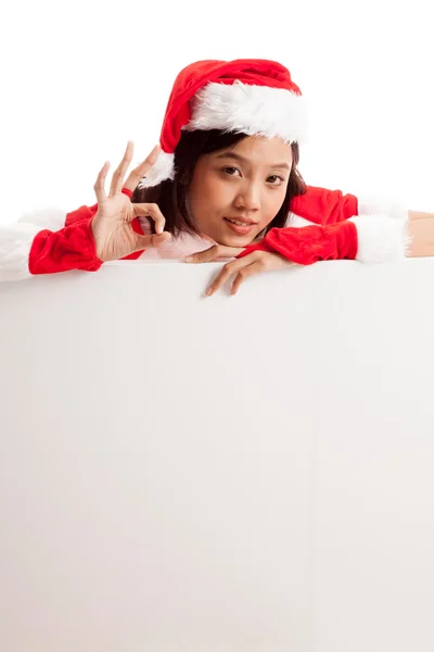 Asya Noel Noel Baba kız göster: Tamam boş işaretiyle — Stok fotoğraf