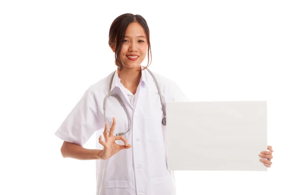 Asian female doctor show OK sign with blank sign — Stock Photo, Image