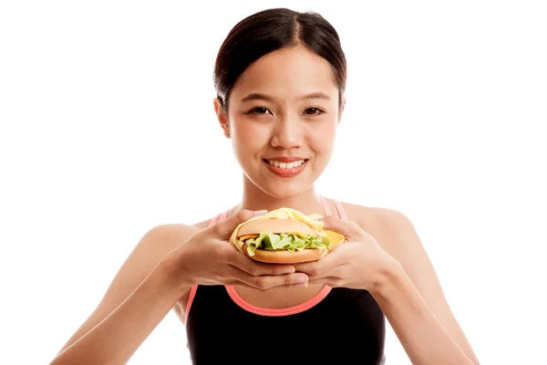 Beautiful Asian healthy girl enjoy eating  hamburger — Stock Photo, Image