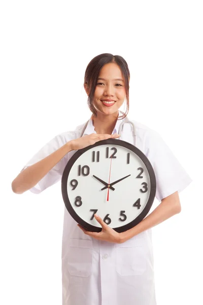 Young Asian female doctor happy show a clock — Stock Photo, Image