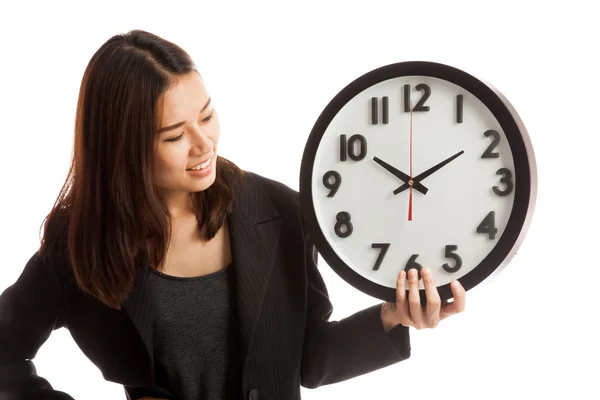 Young Asian business woman with a clock. — Stock Photo, Image