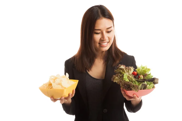Young Asian business woman with potato chips and salad. — Stock Photo, Image