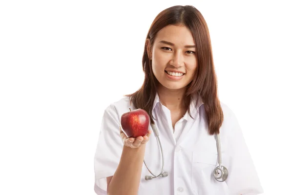 Young Asian female doctor show apple. — Stock Photo, Image