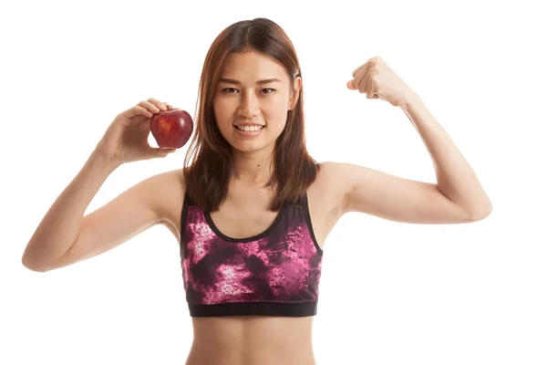 Gyönyörű ázsiai lány egészséges flexing bicepsz, piros Alma. — Stock Fotó