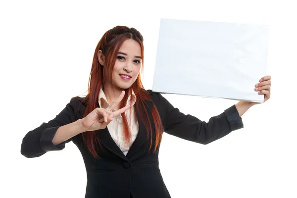 Junge asiatische Geschäftsfrau zeigt Siegeszeichen mit leerem Schild. — Stockfoto