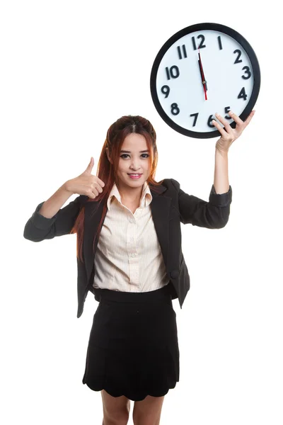 Young Asian business woman thumbs up with a clock. — Stock Photo, Image