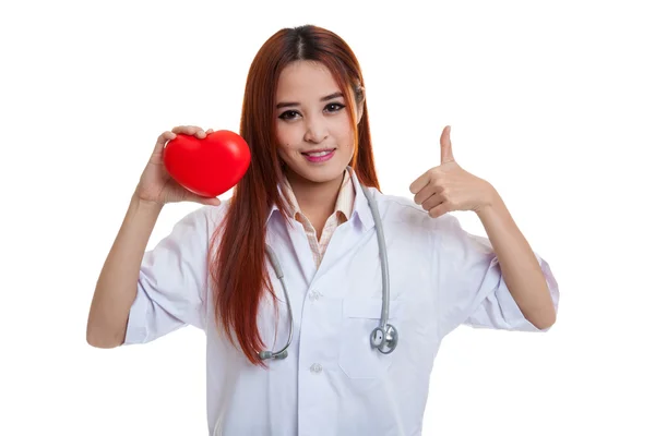 Young Asian female doctor show thumbs up with red heart. — Stock Photo, Image