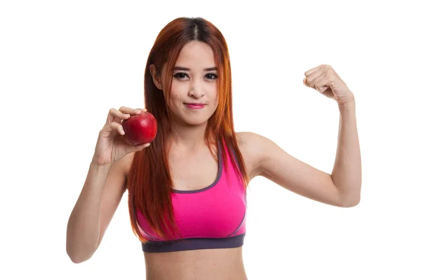 Bela ásia saudável menina flexão bíceps com vermelho maçã . — Fotografia de Stock