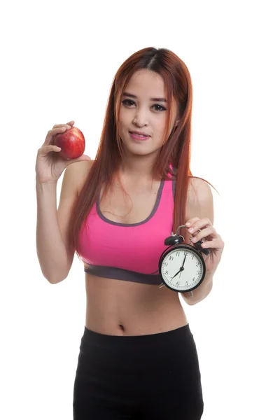 Азиатская здоровая девочка с часами и яблоком . — стоковое фото