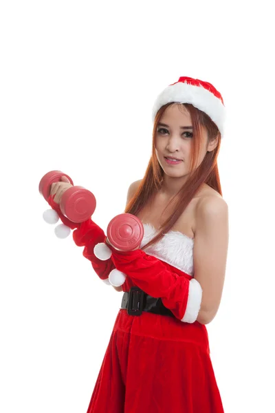 Asiatiska Christmas flicka med Santa Claus kläder och röda hantlar. — Stockfoto