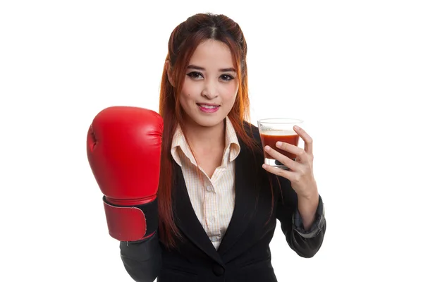 Young Asian business woman with tomato juice and boxing glove. — Stock Photo, Image