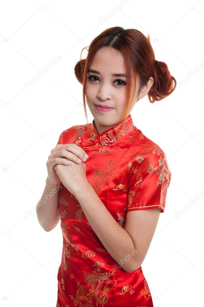 Asian girl in chinese cheongsam dress with gesture of congratula