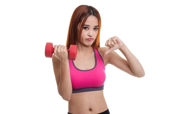 Beautiful Asian healthy girl thumbs down with dumbbell. — Stock Photo, Image