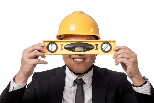 Asian businessman hold a spirit level in front of his eyes and s — Stock Photo, Image