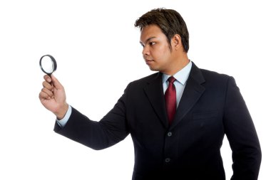 Büyüteç arasında Asya iş adamı göz