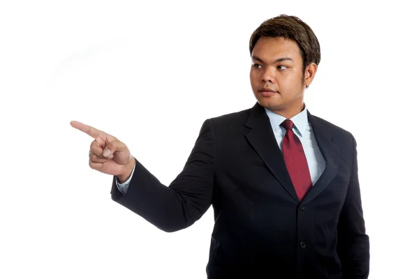 Empresário asiático em terno apontar para a direita — Fotografia de Stock