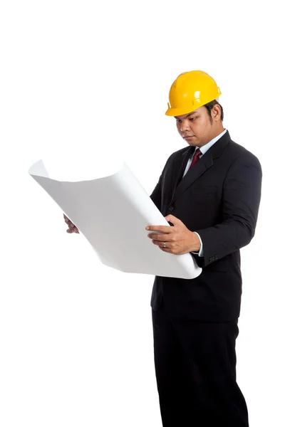 Asian engineer man reading a blueprint — Stock Photo, Image