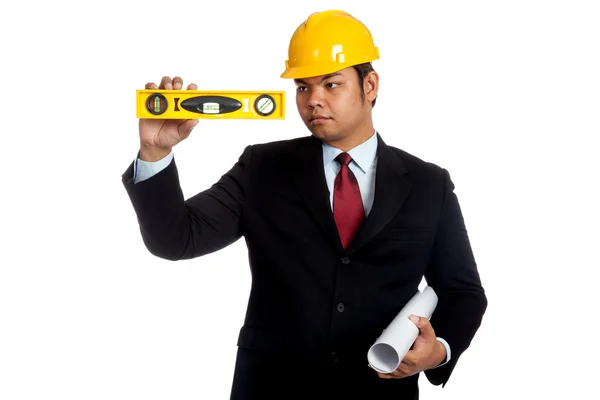 Asian engineer man looking at a level — Stock Photo, Image