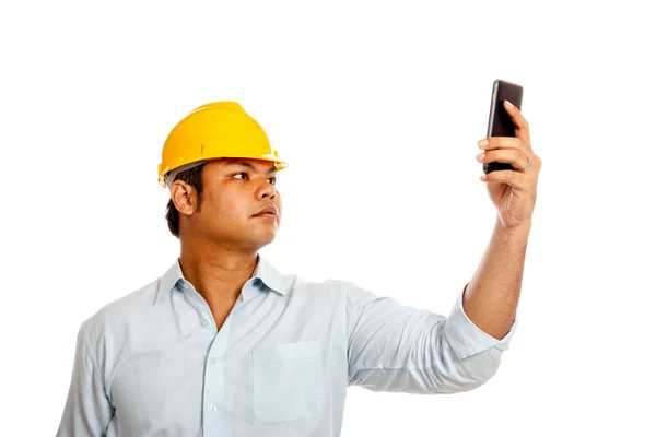 Asian engineer man hold a cellphone search for signal — Stock Photo, Image