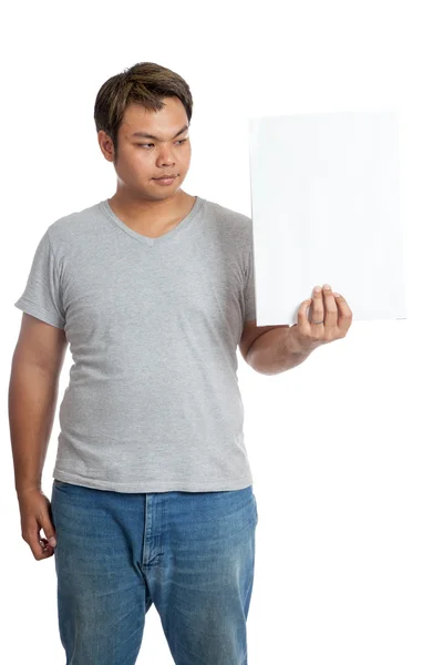 Asian man look at a vertical  blank sign in his hand — Stock Photo, Image