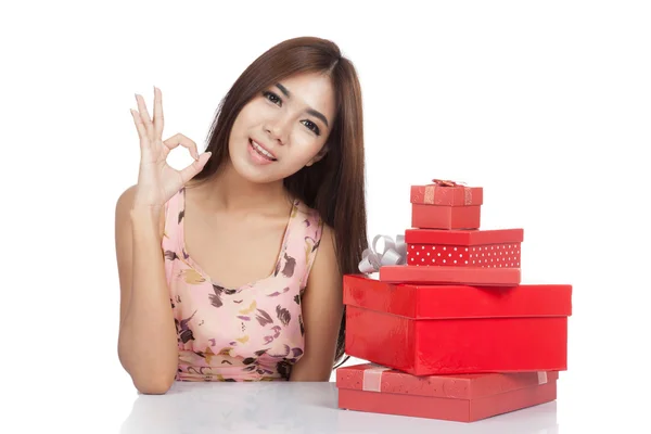 Beautiful Asian woman show OK with red gift box — Stock Photo, Image