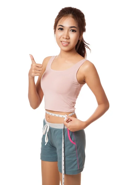 Asian slim girl with measuring tape show thumbs up — Stock Photo, Image