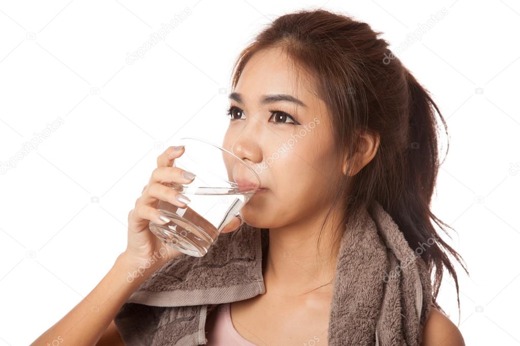 Tired workout asian woman drinking water