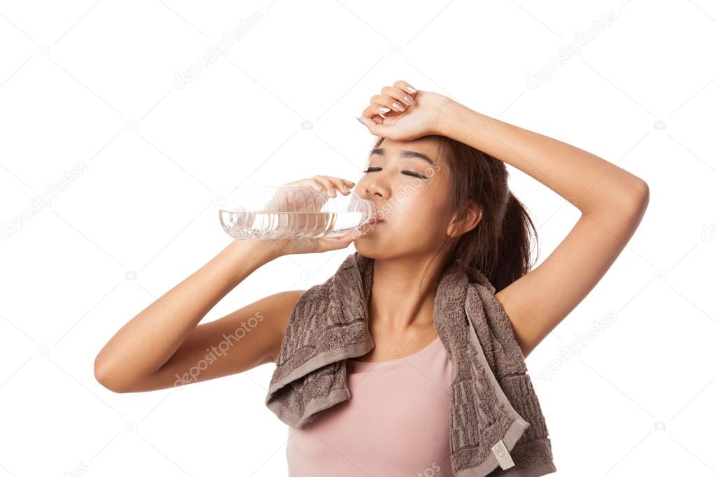 Tired workout asian woman drinking water