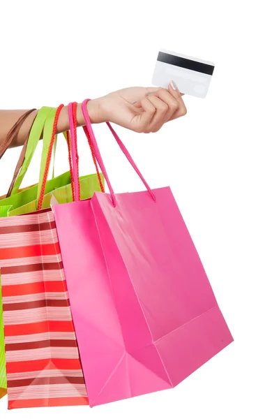 Mujer con tarjeta de crédito y bolsas de compras —  Fotos de Stock