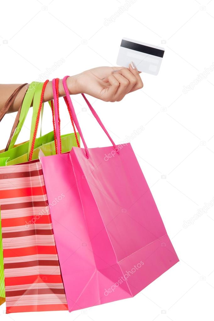 Woman with credit card and  shopping bags