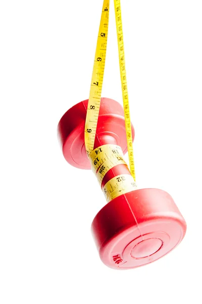 Red dumbbells weight with measuring tape — Stock Photo, Image