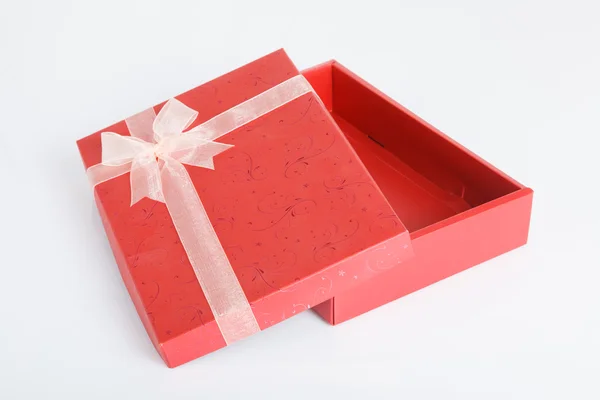 An empty red gift box with the lid off — Stock Photo, Image