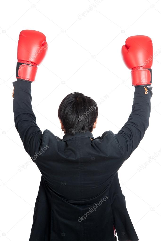 Asian man wear boxing gloves raise his hands up