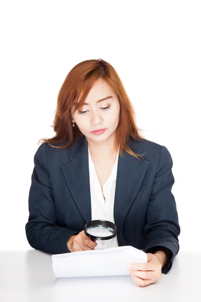 Asian office girl check data with magnifying glass — Stock Photo, Image