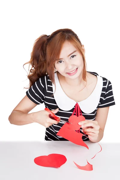 Asian girl cut heart shape paper and smile — Stock Photo, Image