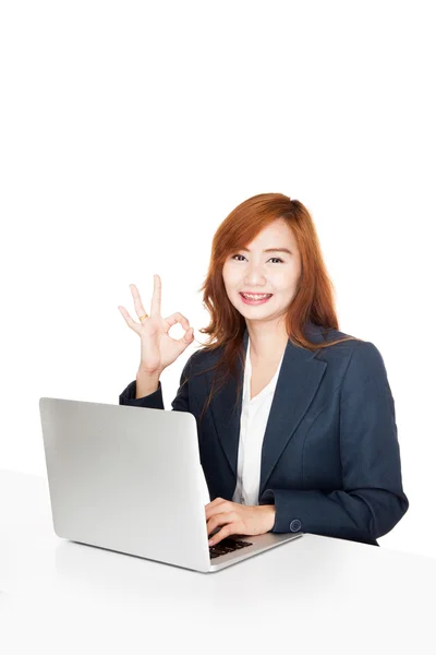 Asian office girl show OK sign with notebook PC — Stock Photo, Image