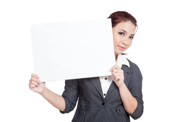 Asiatico businesswoman peeking da dietro un blank segno e sorriso — Foto Stock