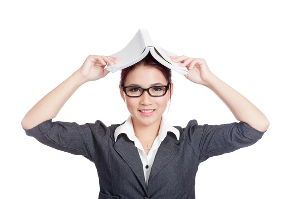 Asian business woman smile put a book over head — Stock Photo, Image