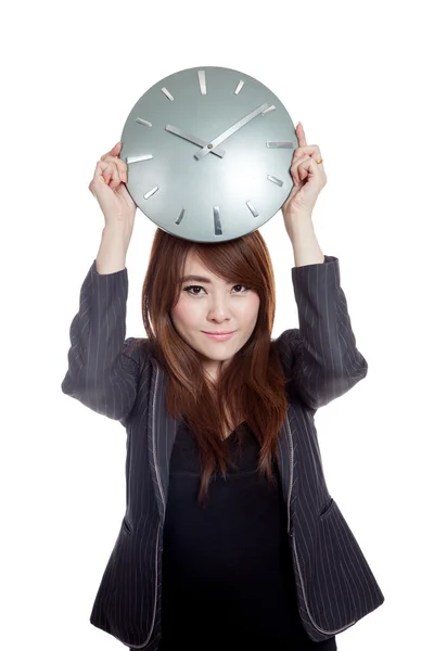 Asian Businesswoman hold a clock over her head — Stock Photo, Image