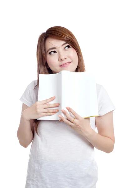 Asiática chica imaginar y sonrisa con un libro — Foto de Stock