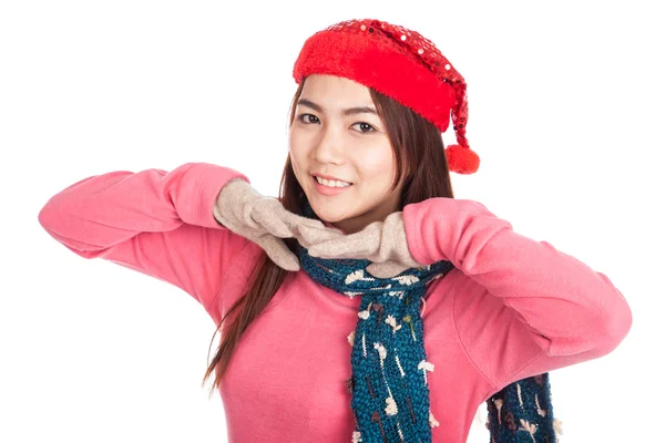 Asian girl smile with red christmas hat with both hands under ch — Stock Photo, Image