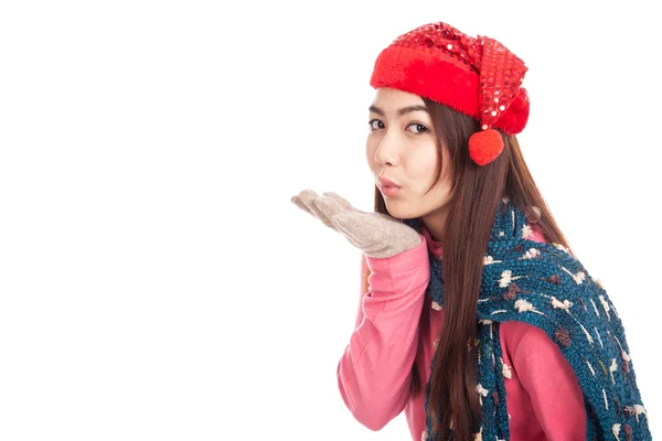 Asian girl with red christmas hat blowing a kiss — Stock Photo, Image